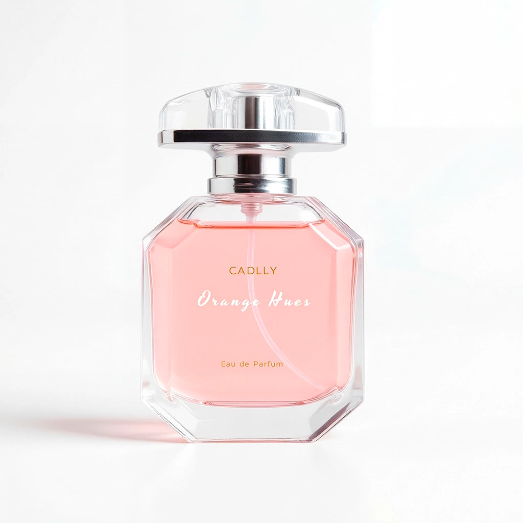 Pink CADLLY perfume bottle with silver cap on a white background