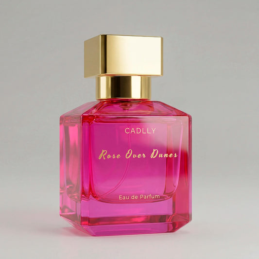 Pink CADLLY perfume bottle with gold cap on a gray background