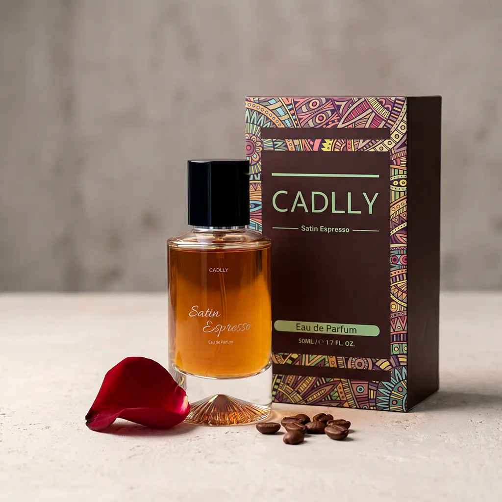 CADLLY Satin Espresso perfume bottle and packaging with a rose petal and coffee beans on a neutral background