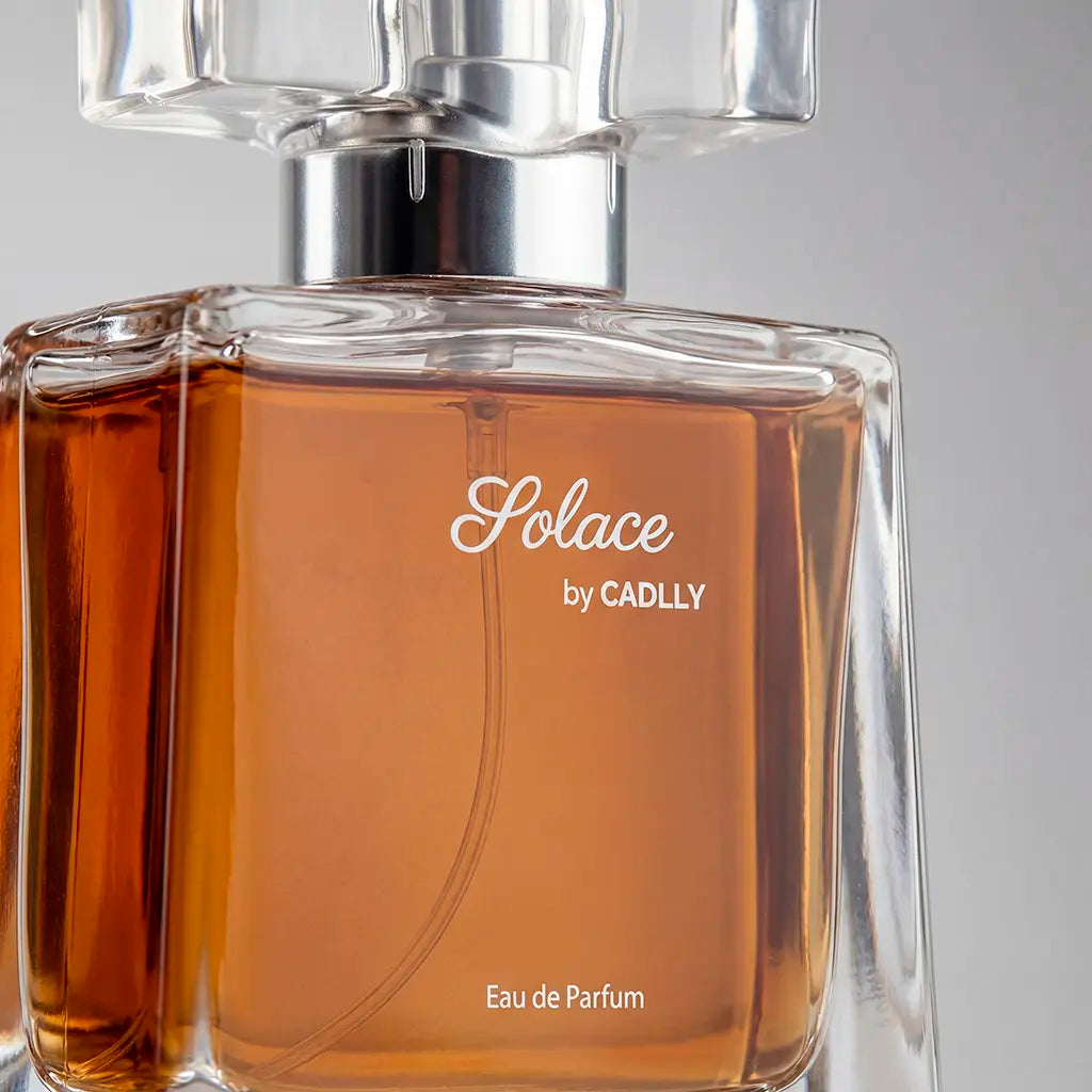 Perfume bottle labeled 'Solace by CADLLY' with a clear cap on a gray background